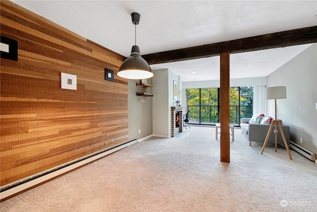 interior space featuring beamed ceiling, baseboard heating, and wood walls