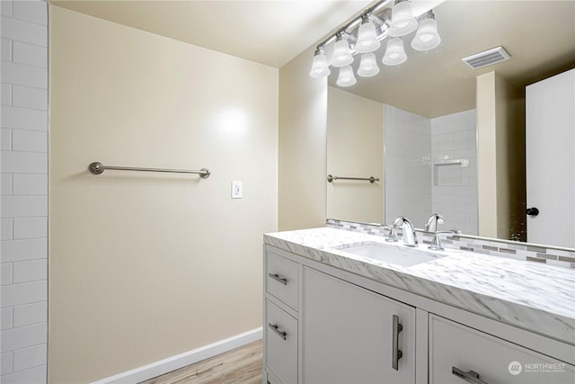 bathroom featuring vanity and wood-type flooring