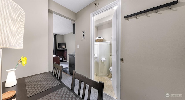 hall with light tile patterned flooring