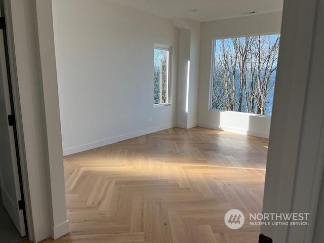 empty room featuring parquet flooring