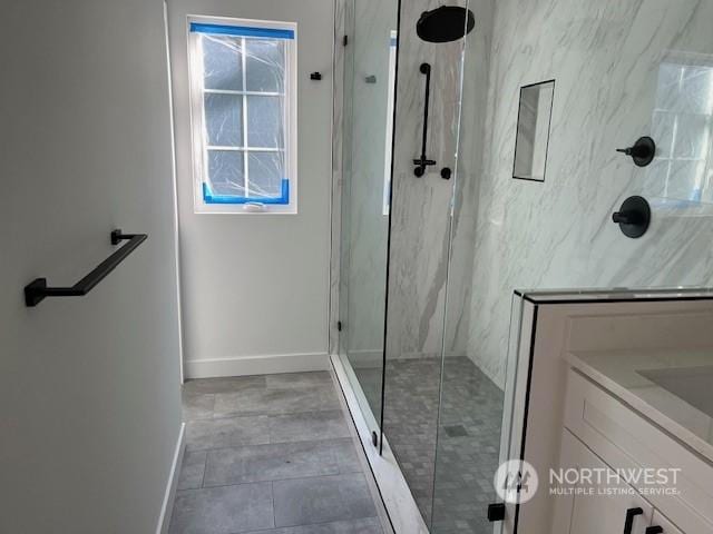 bathroom with vanity and an enclosed shower