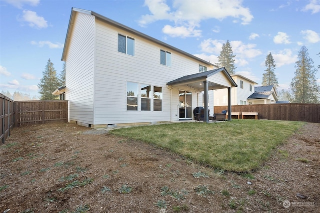 rear view of house with a lawn