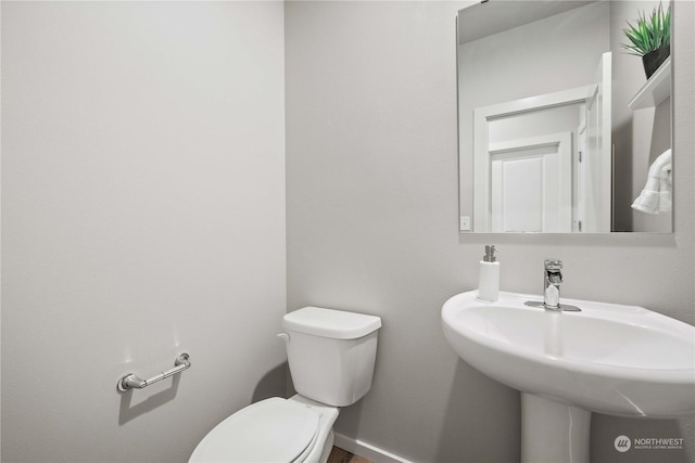 bathroom featuring sink and toilet