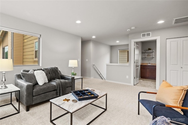 living room featuring light carpet