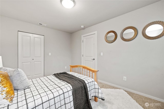 carpeted bedroom featuring a closet