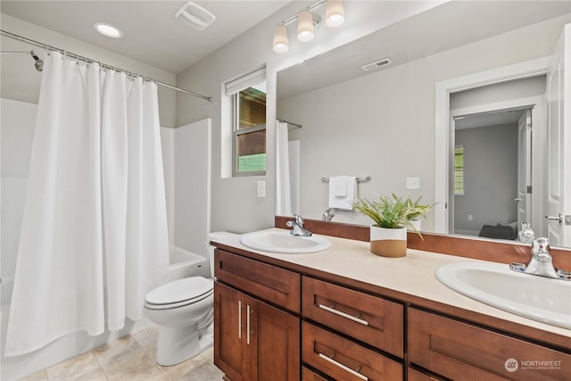 full bathroom featuring tile patterned flooring, vanity, shower / bathtub combination with curtain, and toilet