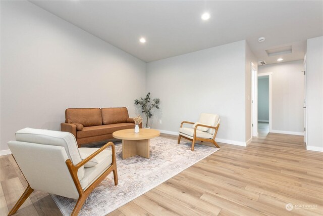 living room with light hardwood / wood-style flooring