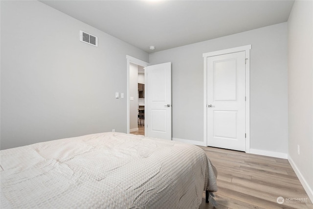 bedroom featuring light hardwood / wood-style floors