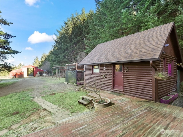 wooden deck with an outdoor structure