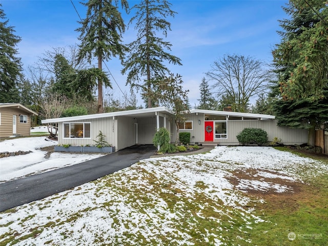 view of front of home featuring a carport