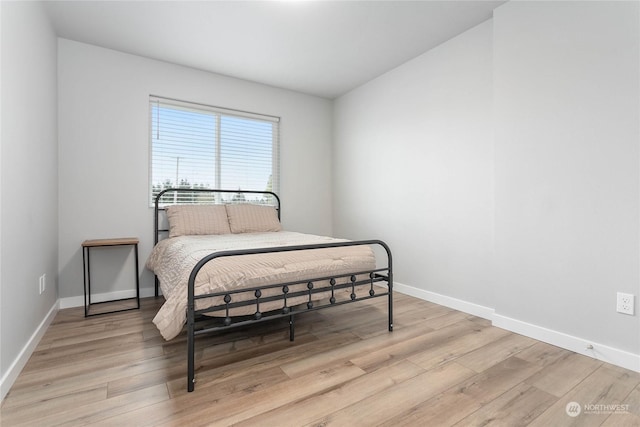 bedroom with light hardwood / wood-style floors