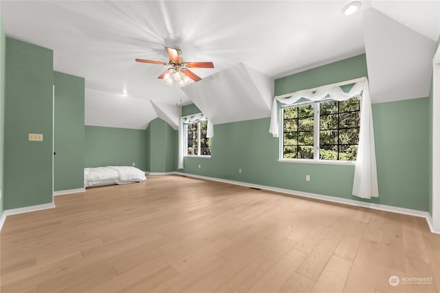 bonus room with vaulted ceiling, ceiling fan, and light hardwood / wood-style flooring