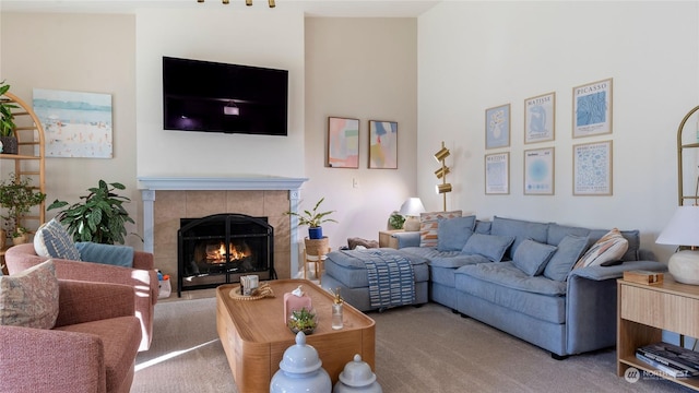 living room featuring a fireplace and carpet flooring