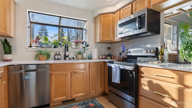 kitchen with appliances with stainless steel finishes and sink