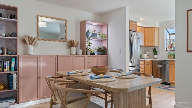 dining space featuring light hardwood / wood-style floors