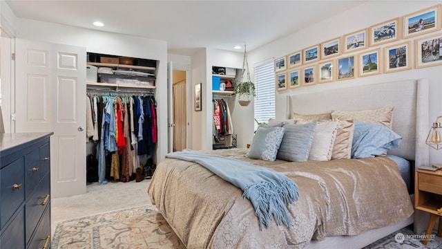 carpeted bedroom featuring a closet