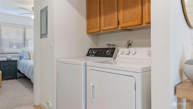 washroom with washer and dryer, light carpet, cabinets, and ceiling fan