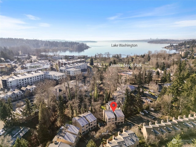 birds eye view of property with a water view