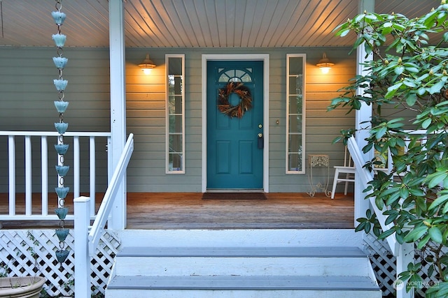 doorway to property featuring covered porch