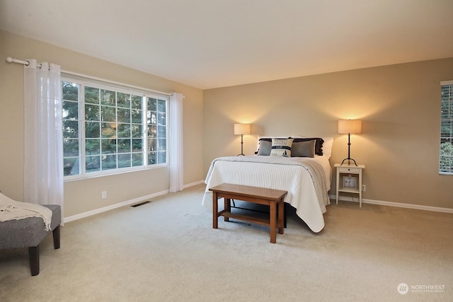 bedroom with light colored carpet