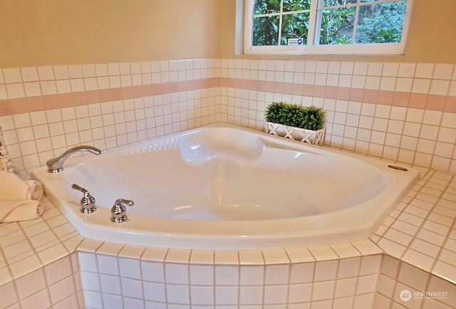 bathroom with tiled bath