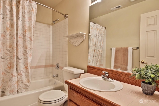 full bathroom featuring vanity, shower / tub combo, and toilet