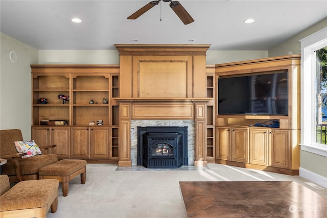 living room featuring light carpet and ceiling fan