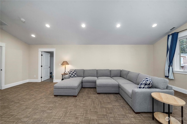 carpeted living room featuring lofted ceiling