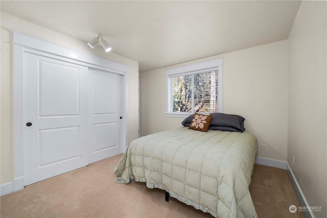 bedroom with carpet floors and a closet