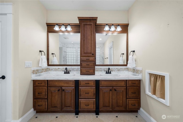 bathroom featuring vanity, tile patterned flooring, and decorative backsplash