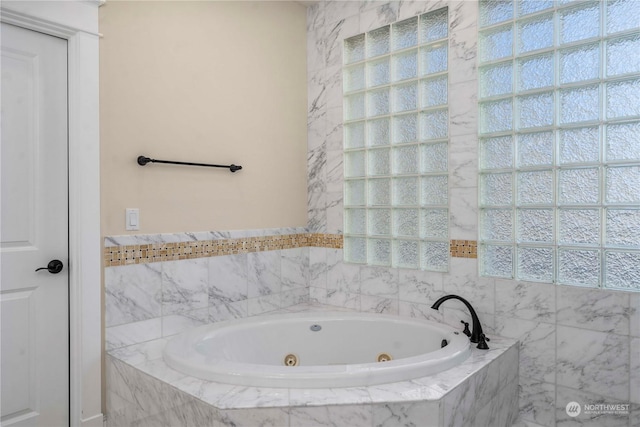 bathroom with tiled tub