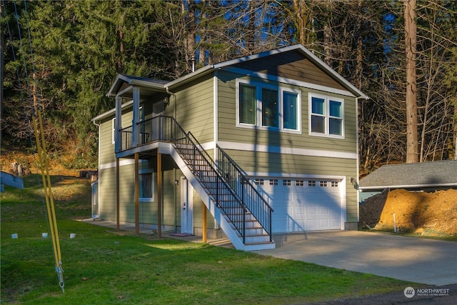 view of front of property featuring a garage and a front lawn