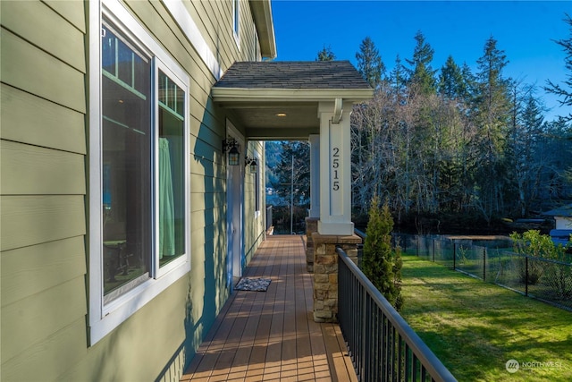 exterior space with a porch and a lawn