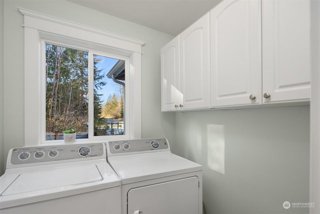 laundry area featuring cabinets and washer and dryer