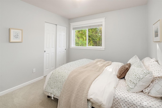 carpeted bedroom with a closet