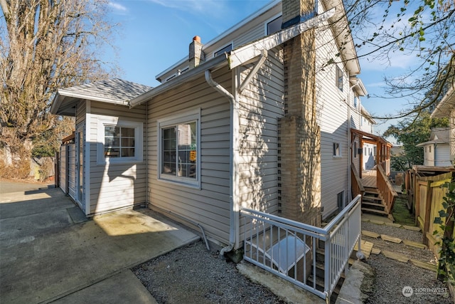 view of property exterior featuring a patio