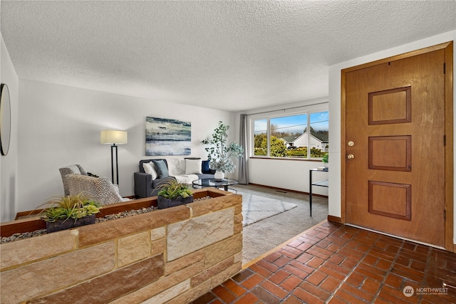 entrance foyer with a textured ceiling