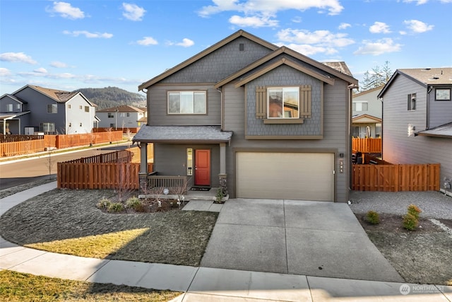 view of front of home featuring a garage and covered porch