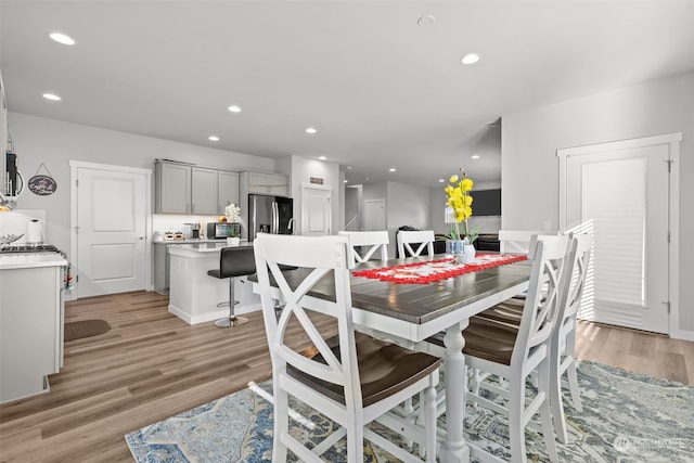 dining area with light hardwood / wood-style floors