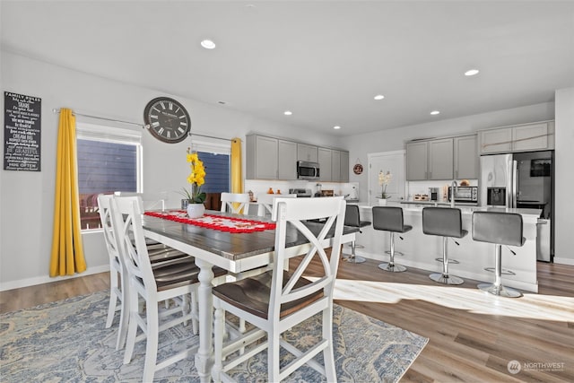 dining area with light wood-type flooring