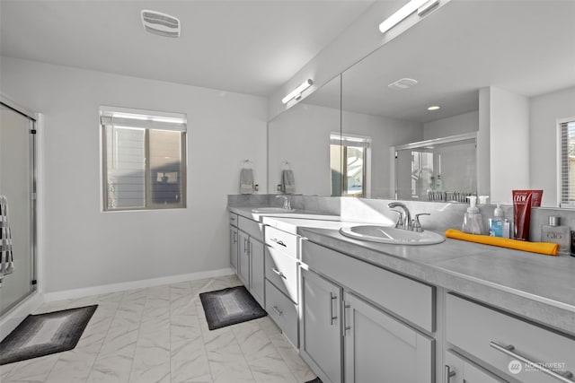 bathroom featuring vanity and an enclosed shower