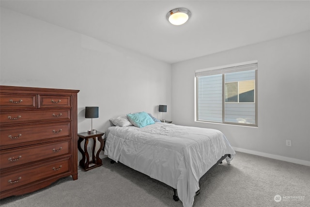 bedroom with light colored carpet