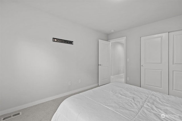 bedroom with carpet floors and a closet