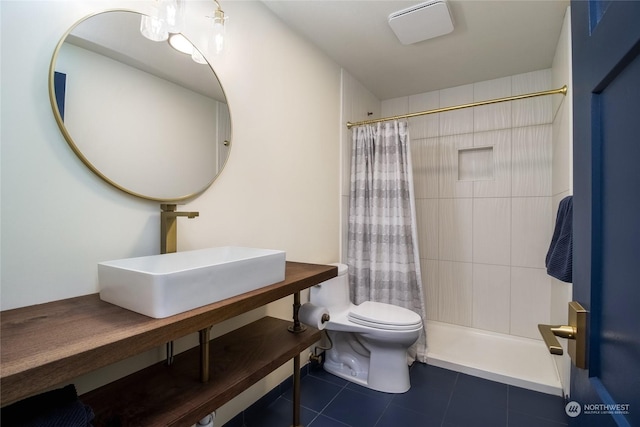 bathroom with toilet, sink, tile patterned floors, and walk in shower