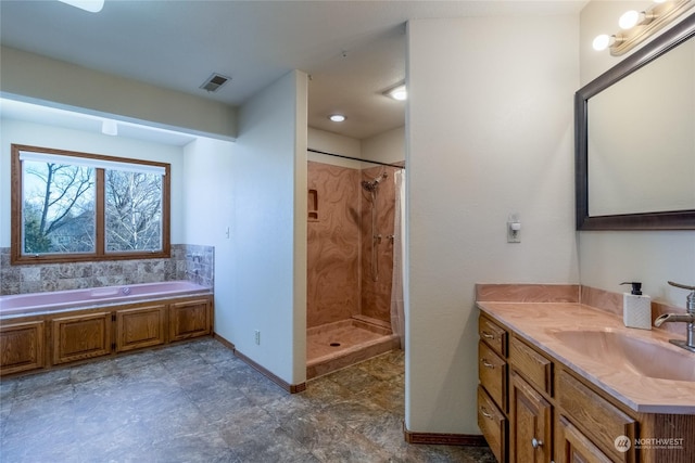 bathroom featuring independent shower and bath and vanity