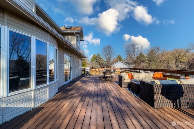 wooden deck featuring an outdoor living space