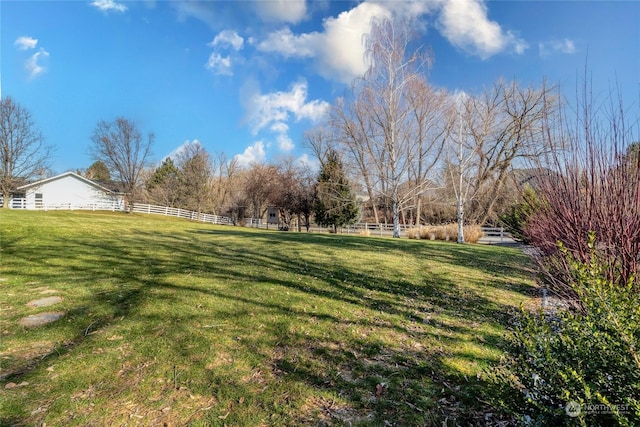 view of yard with a rural view