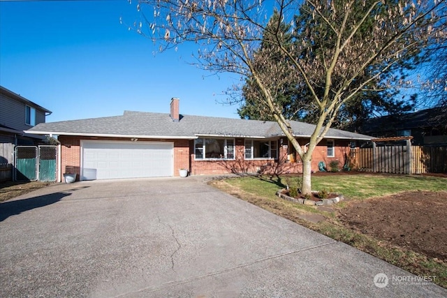 single story home featuring a garage and a front lawn