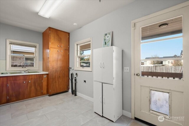 kitchen featuring sink and white fridge