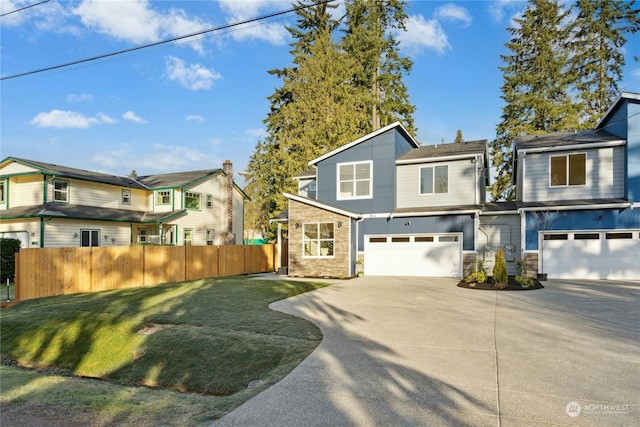 view of front of house featuring a garage and a front yard